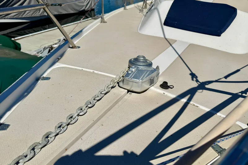 Slide: The Image of Deck of 1988 Catalina 34 sailboat with anchor chain and winch. - 6