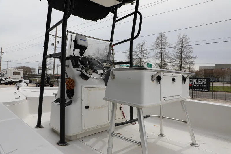Slide: The Image of 2002 Ranger 2300 Bay Ranger boat interior with steering console and seating. - 12