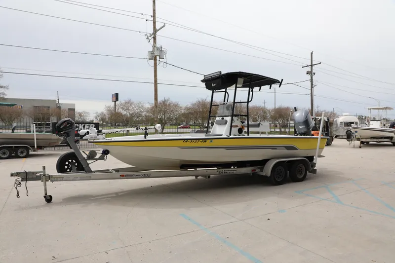 Slide: The Image of 2002 Ranger 2300 Bay Ranger boat on trailer in parking lot. - 7