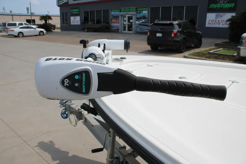 The Image of 2014 Mako 18 LTS boat with Minn Kota Riptide trolling motor in dealership lot. - 1