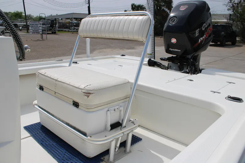 Slide: The Image of 2014 Mako 18 LTS boat interior with seating and outboard motor. - 11