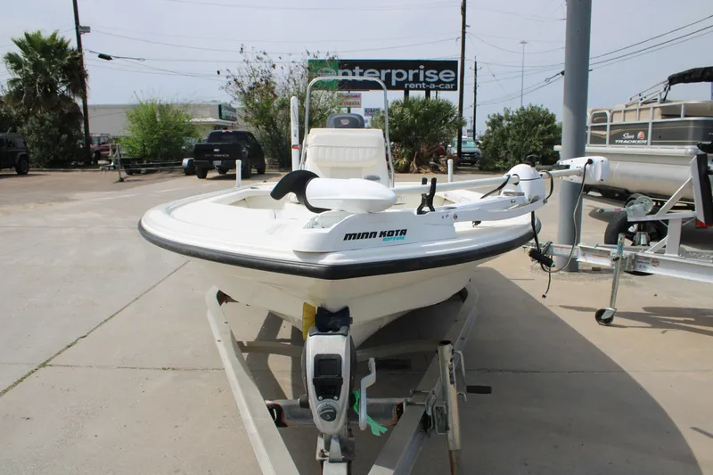 Slide: The Image of 2014 Mako 18 LTS boat on trailer with Minn Kota trolling motor. - 3