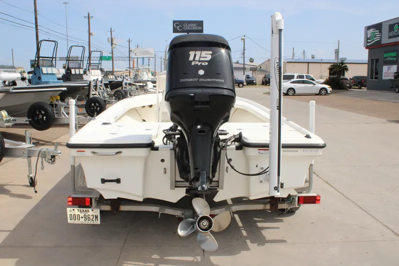 Slide: The Image of 2014 Mako 18 LTS boat with 115 Pro outboard motor on trailer. - 7