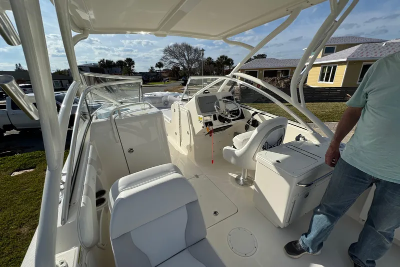 Slide: The Image of 2012 Edgewater 245CX Crossover boat interior with seating and steering console. - 13