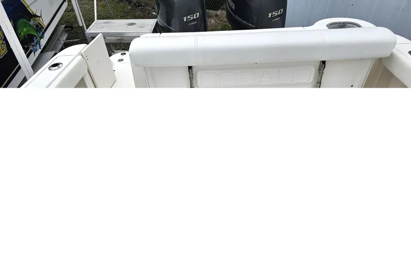 Slide: The Image of 2013 Robalo R247 Dual Console boat with Yamaha 150 engines, rear seating view. - 18