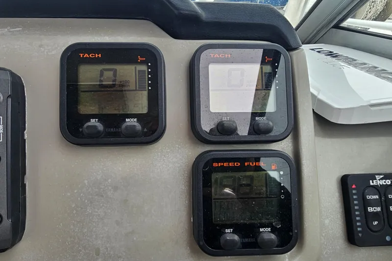 Slide: The Image of Dashboard of a 2013 Robalo R247 Dual Console boat with Yamaha gauges. - 28