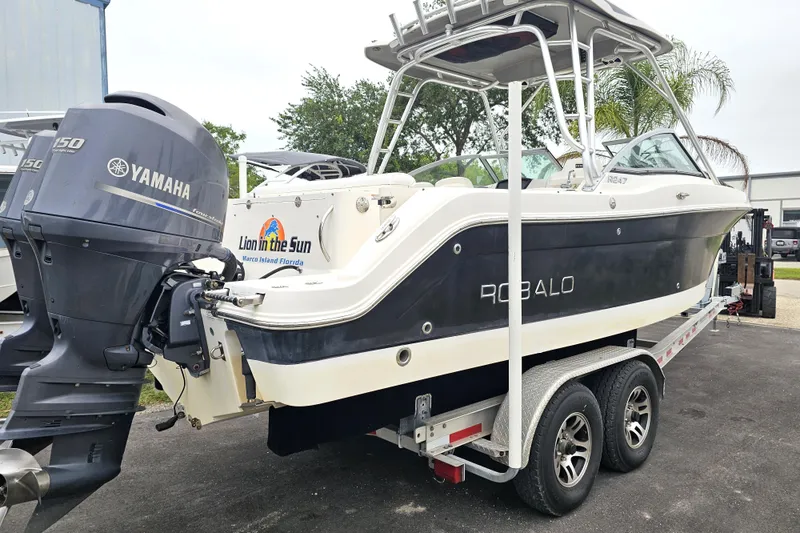Slide: The Image of 2013 Robalo R247 Dual Console boat on trailer with Yamaha outboard motor. - 3