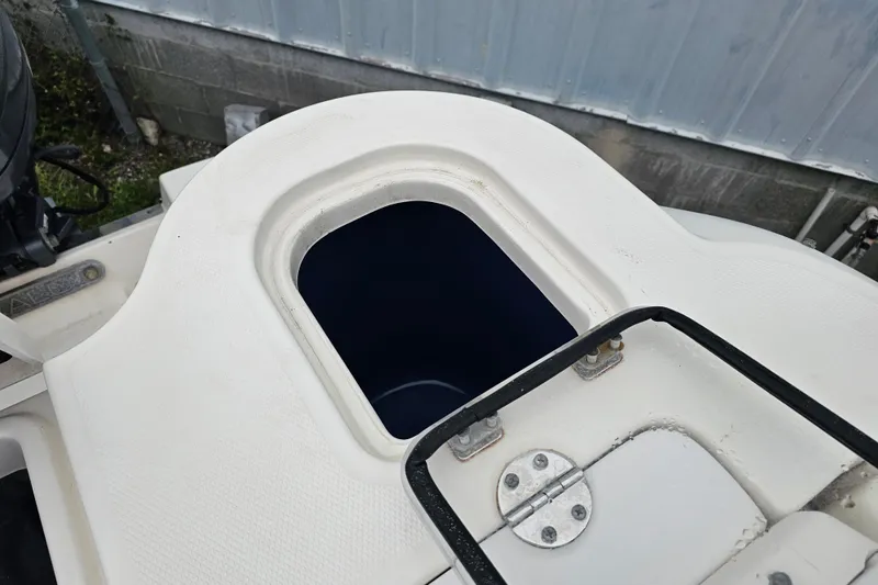 Slide: The Image of 2013 Robalo R247 Dual Console boat storage compartment detail. - 31
