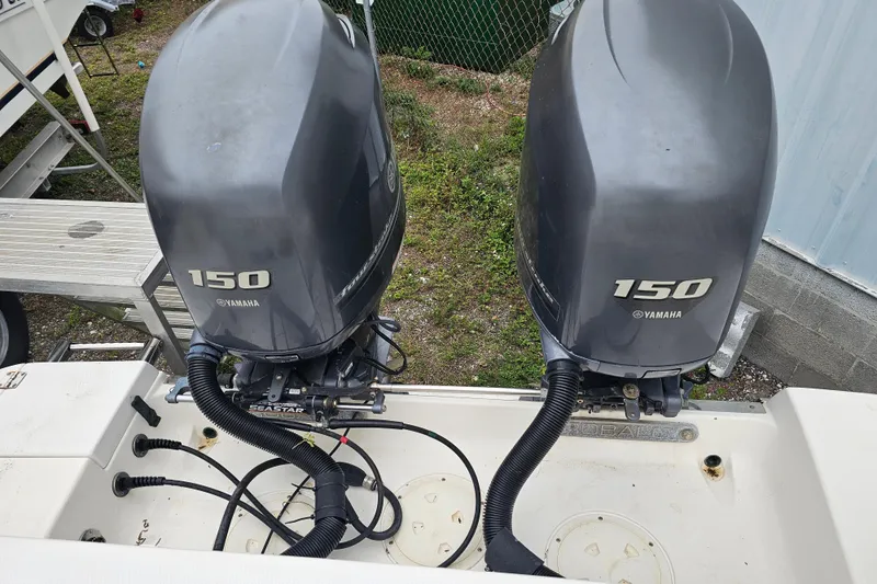 Slide: The Image of 2013 Robalo R247 Dual Console with twin Yamaha 150 outboard engines. - 33
