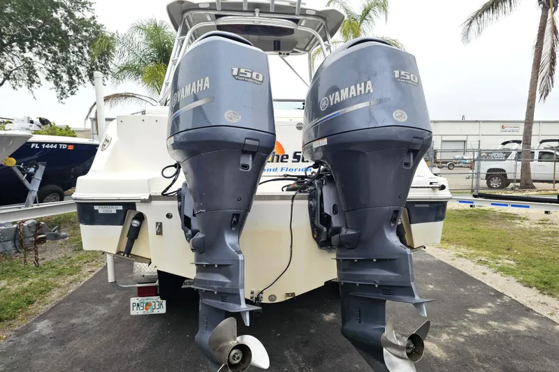 Slide: The Image of 2013 Robalo R247 Dual Console with twin Yamaha 150 outboard motors. - 5