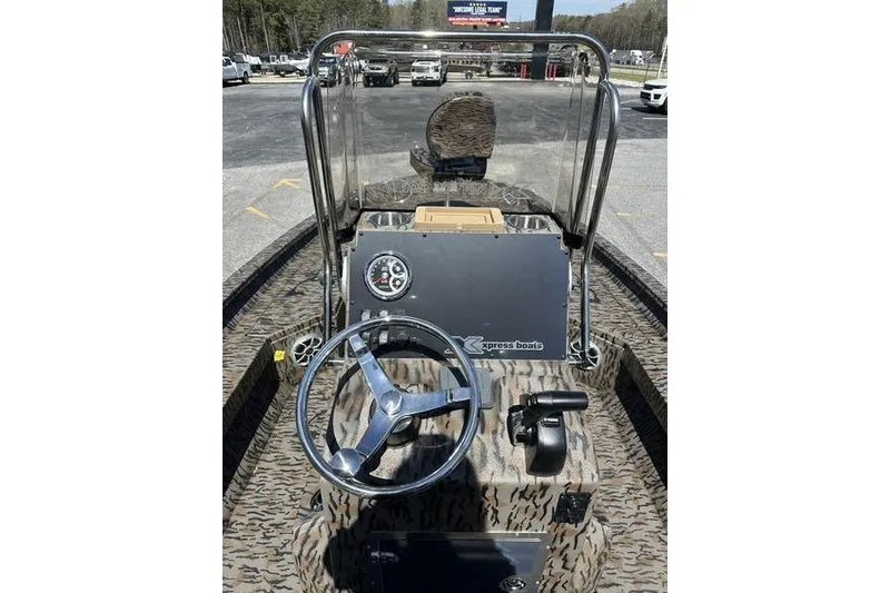 Slide: The Image of 2026 Xpress H20B Bay boat dashboard with steering wheel and controls. - 10