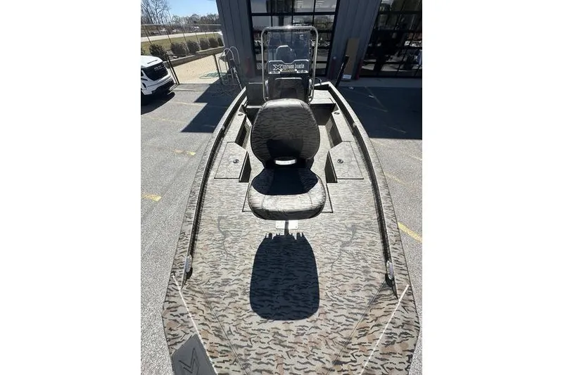 Slide: The Image of 2026 Xpress H20B Bay boat with camouflage design and seating. - 3