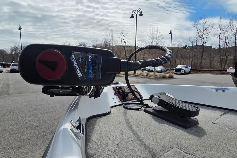 Slide: The Image of Triton SF-18 boat with MotorGuide Brute 67 trolling motor in a parking lot, 2004 model. - 6