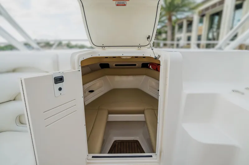 Slide: The Image of 2007 Boston Whaler 320 Outrage Cuddy Cabin interior with open hatch and seating. - 1