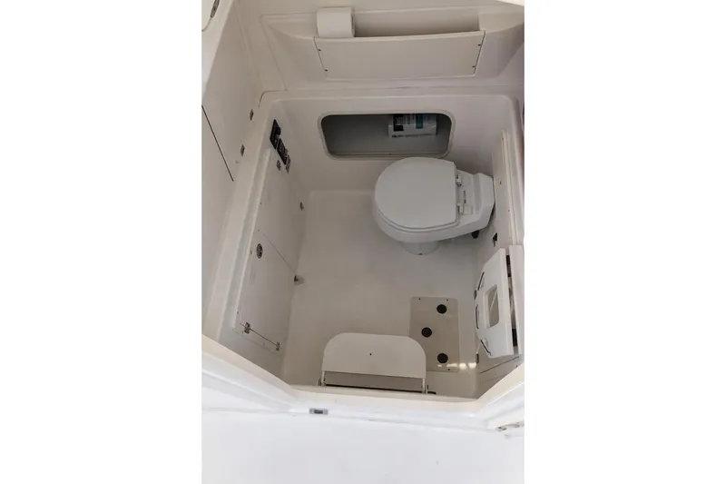 Slide: The Image of Interior of 2007 Boston Whaler 320 Outrage Cuddy Cabin bathroom with toilet. - 3