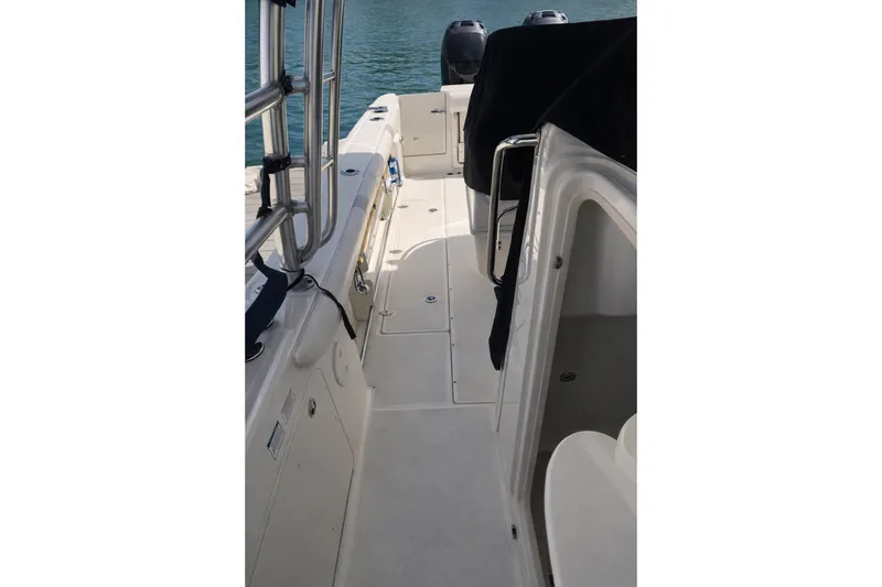 Slide: The Image of 2007 Boston Whaler 320 Outrage Cuddy Cabin interior view, showcasing deck and seating. - 4