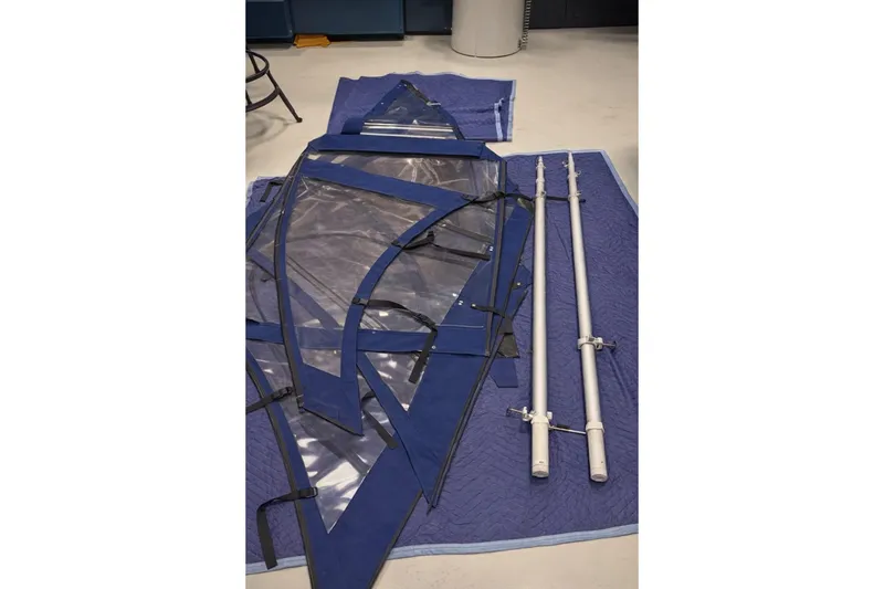 Slide: The Image of Boston Whaler 320 Outrage Cuddy Cabin 2007 boat parts on blue mat. - 8