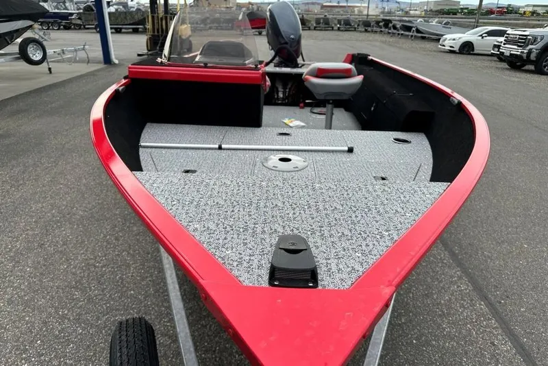 Slide: The Image of 2026 Smoker Craft Lazer 161 boat with red trim and spacious deck. - 5