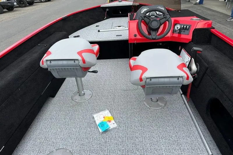 Slide: The Image of Interior of 2026 Smoker Craft Lazer 161 boat with red and gray seating. - 6