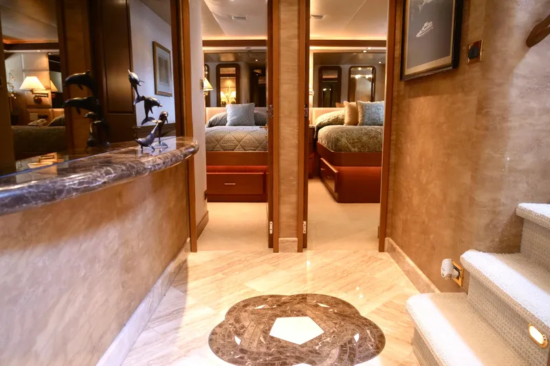 Slide: The Image of Luxurious interior of 2000 Westport 112 yacht with elegant marble flooring and plush bedroom. - 10