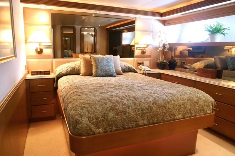 Slide: The Image of Luxurious bedroom interior on 2000 Westport 112 yacht with elegant decor and ambient lighting. - 11