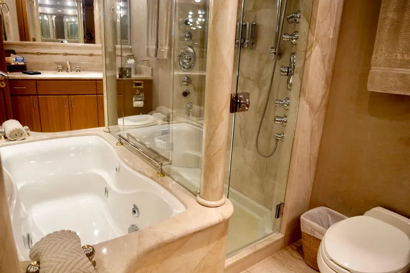 Slide: The Image of Luxurious bathroom in 2000 Westport 112 yacht with jacuzzi and glass shower. - 20