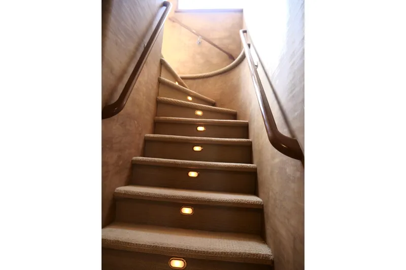 Slide: The Image of Curved staircase with carpet and lights on a Westport 112 yacht, 2000 model. - 23