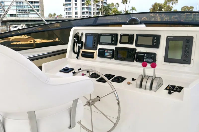 Slide: The Image of Helm of 2000 Westport 112 yacht with navigation controls and steering wheel. - 26