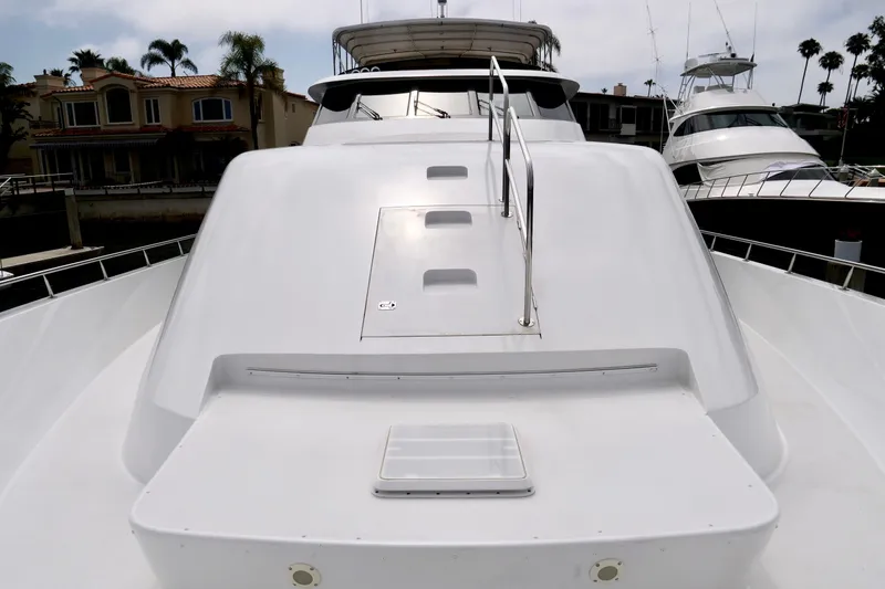 Slide: The Image of Luxury yacht Westport 112, 2000 model, docked with sleek white exterior and modern design. - 3