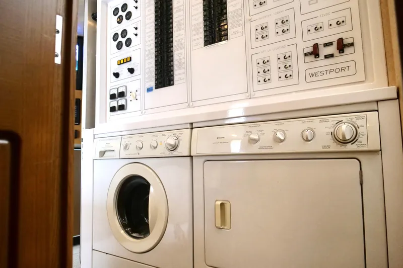 Slide: The Image of Laundry area with control panels on a 2000 Westport 112 yacht. - 37