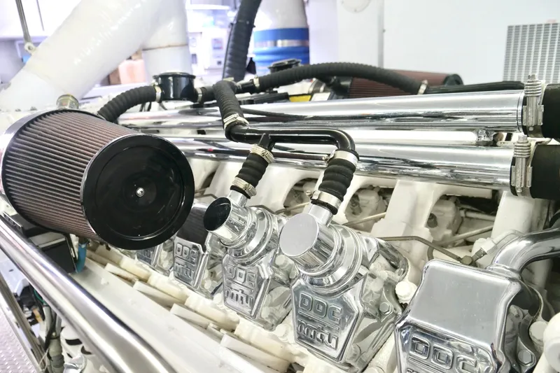 Slide: The Image of Close-up of a Westport 112 yacht engine, showcasing chrome details and air filter. - 43