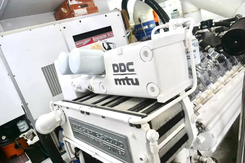 Slide: The Image of Engine room of a 2000 Westport 112 yacht featuring a DDC MTU engine. - 47