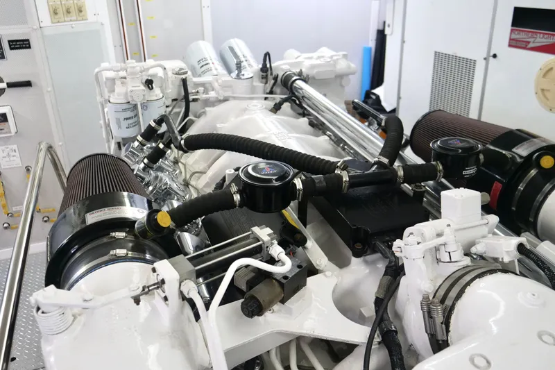 Slide: The Image of Engine room of a 2000 Westport 112 yacht, showcasing detailed mechanical components. - 48