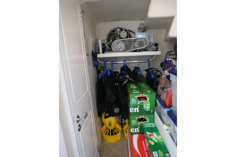 Slide: The Image of Storage area on a 2000 Westport 112 yacht with diving gear and beverages. - 50
