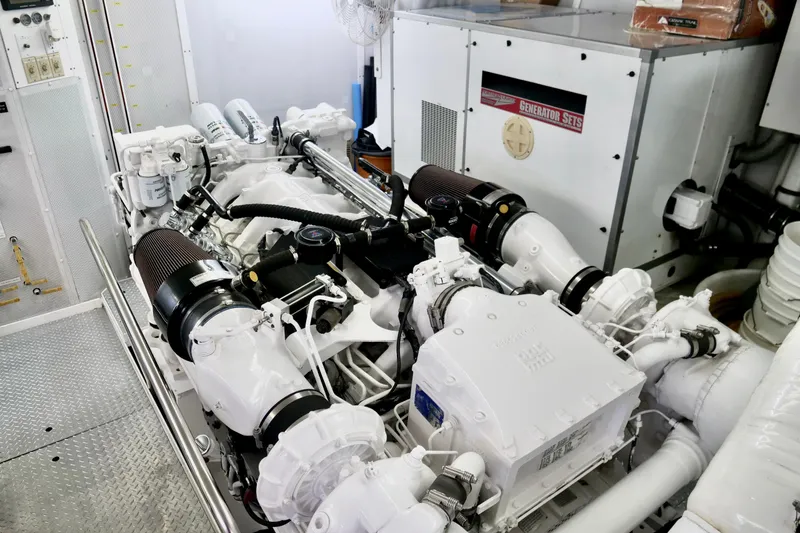 Slide: The Image of Engine room of a 2000 Westport 112 yacht, featuring a powerful generator system. - 56