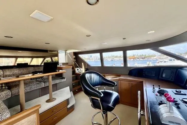 Slide: The Image of Luxurious interior of 2000 Westport 112 yacht with panoramic windows and modern helm. - 61