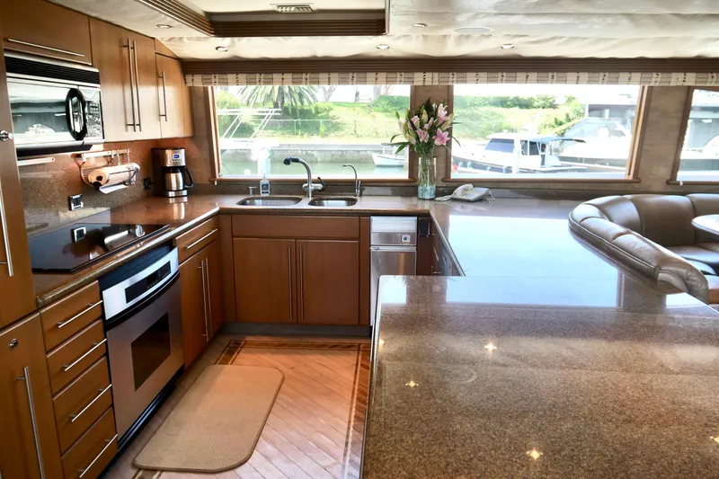 Slide: The Image of Luxurious kitchen interior on 2000 Westport 112 yacht with modern appliances and scenic view. - 65