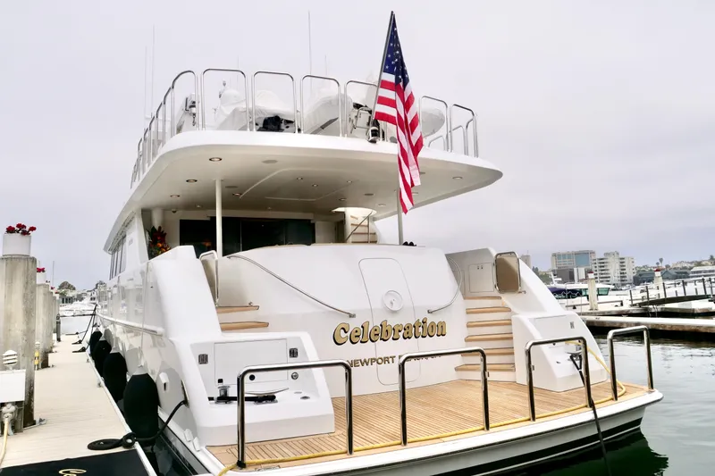 Slide: The Image of Luxury yacht "Celebration" docked, Westport 112 model, 2000, with American flag. - 78