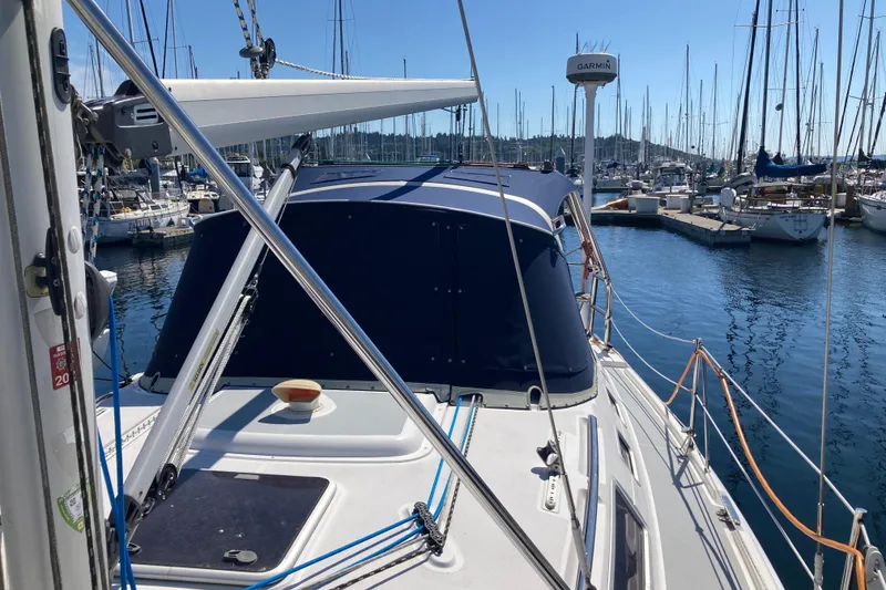 Slide: The Image of Sailboat Hunter 356, 2003 model, docked in a marina with clear blue skies. - 6