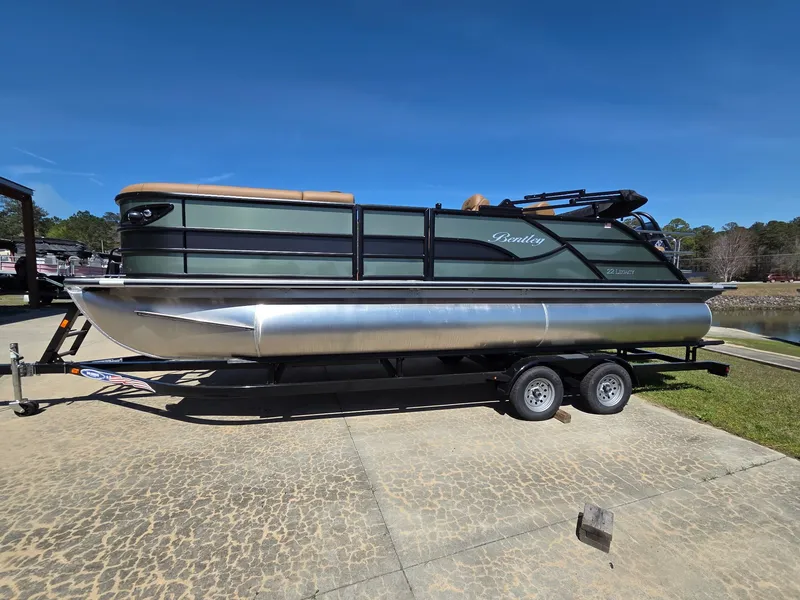 The Image of 2026 Bentley Pontoons Legacy 223 on trailer, sunny day. - 0