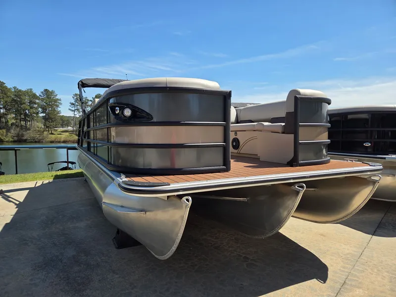 Slide: The Image of 2026 Bentley Pontoons Legacy Quad 243 on a parking lot. - 10