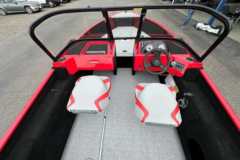 Slide: The Image of 2026 Smoker Craft Lazer 162 boat interior with red and gray seating and steering console. - 7