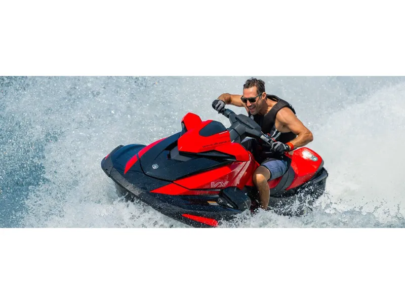 Slide: The Image of Man riding 2024 Yamaha VX Limited jet ski on water. - 17