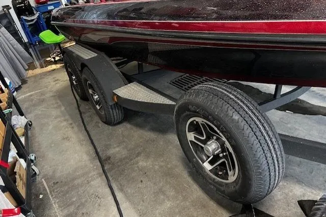Slide: The Image of 2015 Ranger Z518 Cup-Equipped boat on trailer in garage setting. - 2