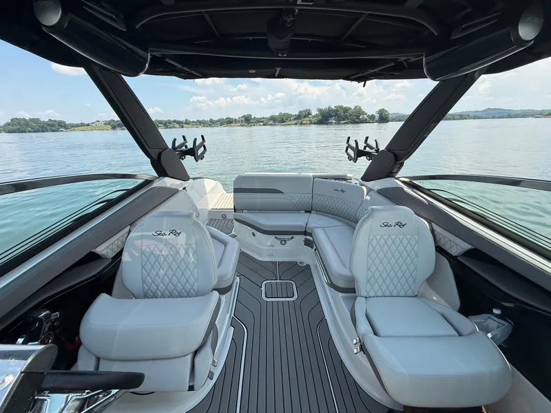 Slide: The Image of Luxurious interior of 2023 Sea Ray SLX 260 Surf boat with elegant seating and lake view. - 26