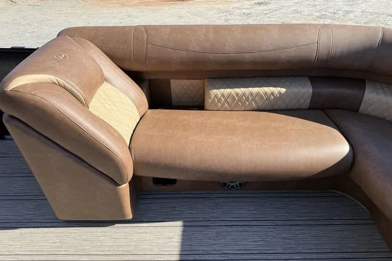 Slide: The Image of Luxurious seating in 2026 Premier 330 Escalante boat, featuring elegant brown upholstery. - 11