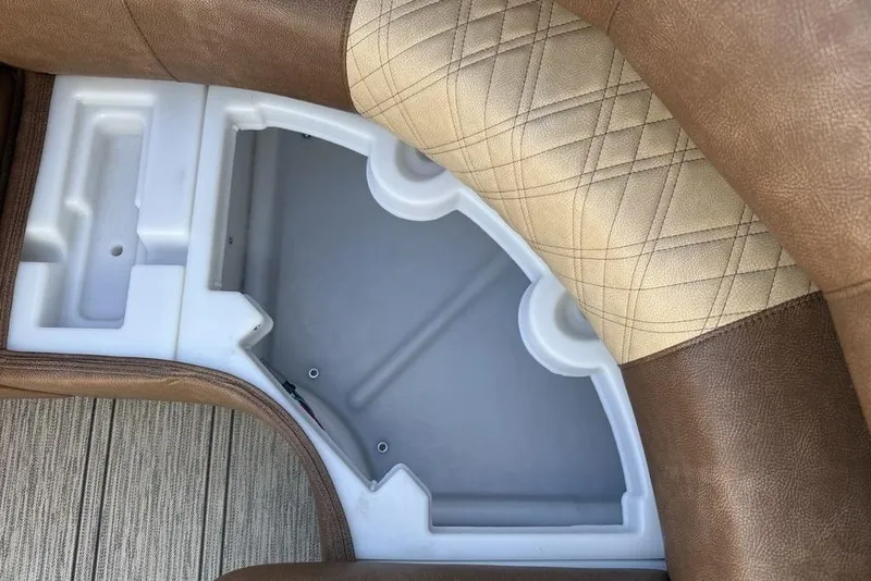 Slide: The Image of Interior seating detail of 2026 Premier 330 Escalante with quilted leather and storage compartment. - 13