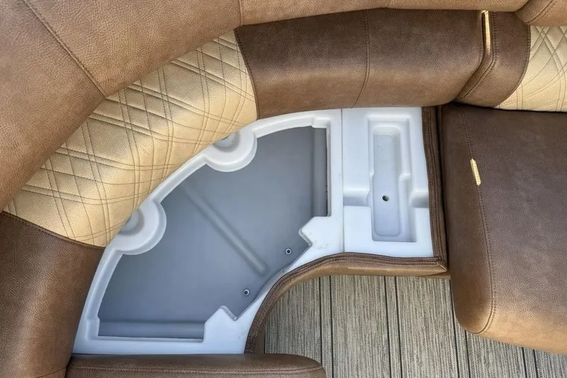 Slide: The Image of Luxurious seating detail of 2026 Premier 330 Escalante with storage compartment. - 16