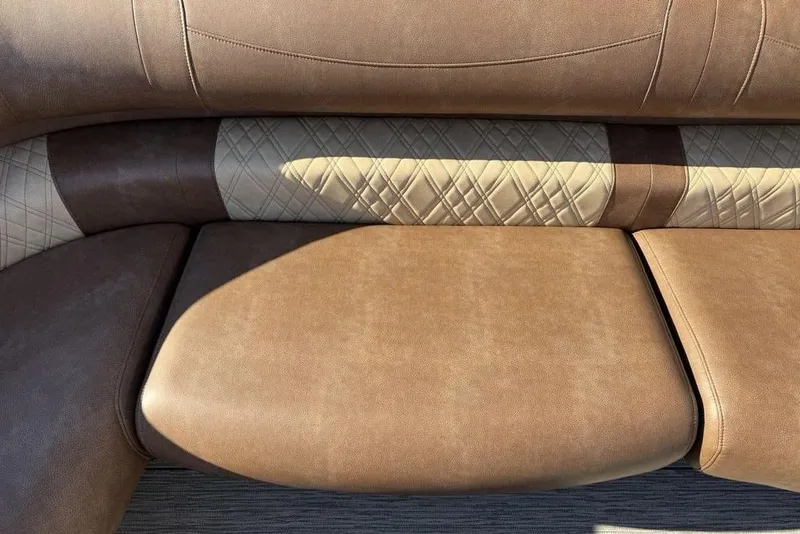 Slide: The Image of Luxurious brown leather seating in 2026 Premier 330 Escalante boat interior. - 18