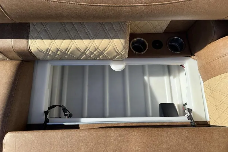 Slide: The Image of Interior of 2026 Premier 330 Escalante with storage compartment and cup holders. - 20